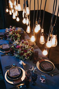 the table is set with candles and place settings