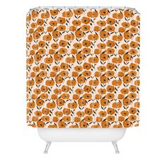 a shower curtain with orange flowers on it