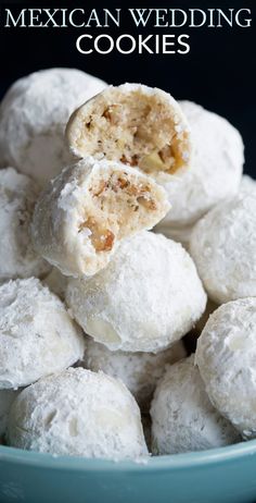 mexican wedding cookies in a blue bowl