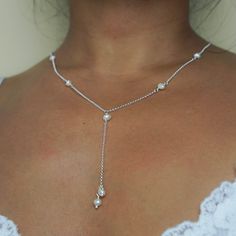 If you want to add a touch of glamour to any outfit, this Sofia necklace is sure to turn heads. This beautiful piece features an eye-catching Y shape design adorned with seven small freshwater pearls on a sophisticated chain. Team it up with a plunging neckline dress or a low-cut top, the Sofia pearl necklace is sure to make a statement. - Free UK delivery on all orders - Handmade in England, UK - A-grade freshwater pearls carefully selected for their organic and natural shapes - Features seven Deep V Neck Jewelry, Cool Silver Necklace, Y Shaped Necklace, Silver And Pearl Necklace, Dainty Silver Jewelry, Gold Chocker Necklace, Cute Jewelry Necklaces, Long Drop Necklace, Karma Jewelry