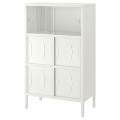 a white cabinet with four doors and three drawers