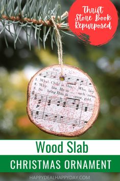 a wooden slab christmas ornament hanging from a tree with the words wood slab on it