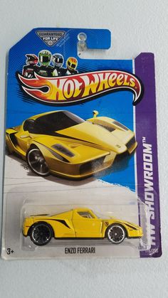 a yellow hot wheels car is on display