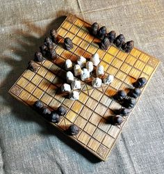 a board game with dices and nuts on it