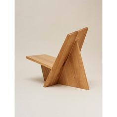 a wooden chair that is shaped like a triangle