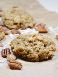 two cookies with pecans and nuts on the table