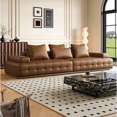 a living room filled with lots of brown furniture