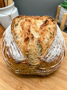 a loaf of bread sitting on top of a wooden table