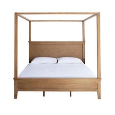 a bed with a wooden frame and white sheets on it's headboard, in front of a white background