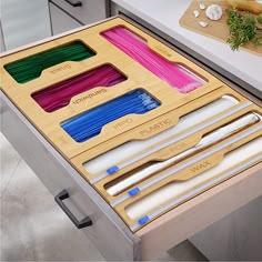 the drawers are organized with different types of utensils