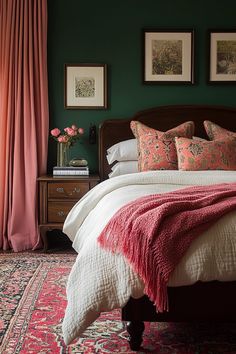 a bedroom with green walls and pink curtains