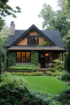 a house with lots of greenery in front of it