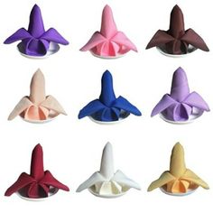 six different colors of paper airplanes on a white background, each with a large bow at the top