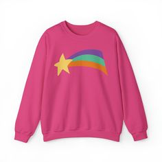 Let Mabel shine without needing to be crafty! Our new Print-On-Demand option ships this sweatshirt directly to your door! *Please note, apparel orders cannot be canceled once submitted.*  Ideal for any situation, a unisex (adult) heavy blend crewneck sweatshirt is pure comfort. These garments are made from polyester and cotton. This combination helps designs come out looking fresh and beautiful. The collar is ribbed knit, so it retains its shape even after washing. There are no itchy side seams Mabel Pines Sweaters, Mabel Sweater, Rainbow Star, Shooting Star, Authentic Design, Pink Sweatshirt, New Print, Pink Sweater, Cut And Style