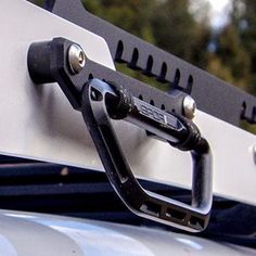 the front end of a vehicle with a tow bar attached to it