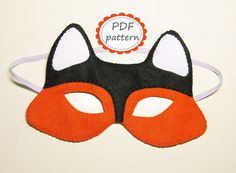 a black and orange mask with white ears