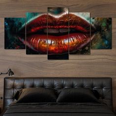 a bed room with a neatly made bed and paintings on the wall above it that have red lips