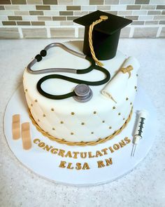 a graduation cake with a stethoscope on top