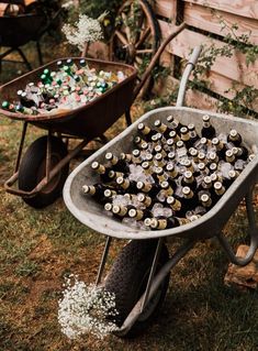 a wheelbarrow filled with lots of beer bottles