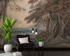 a living room scene with a chair, plant and wall mural in the background that has trees on it