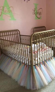 a baby crib in a pink nursery room