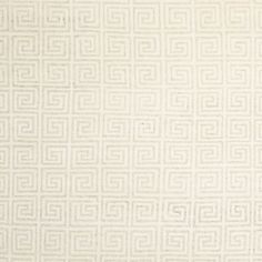 a white rug with an intricate design on it