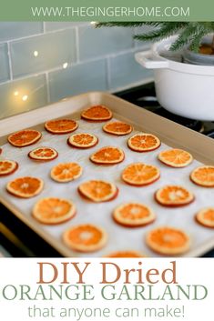 an image of oranges being cooked on the stove with text overlay reading diy dried orange garland that anyone can make