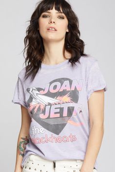 Turn up the volume and add some edge to your closet with this vintage inspired Joan Jett & The Blackhearts tee! This rockin' tee features the band name with a black heart and rocket graphic in the background. Made with super soft vintage washed fabric, cuffed short sleeves, distressed hems, a ribbed crewneck collar, and our classic fitted style. The design of this style is fitted. For a more standard fit choose a size up. Details Style #301997 Color: Lilac Edgy Rocker Joan Jett & The Black Heart Flare Jeans And Sneakers, Turn Up The Volume, Mens Clothing Store, Joan Jett, Concert Looks, Fitted Style, Cuffed Shorts, Turn Up, Black Heart