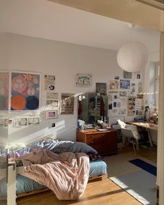 a bed sitting in a bedroom next to a wooden floor