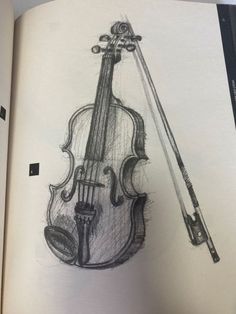 an open book with a drawing of a violin