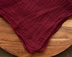 a wooden plate with a red cloth on it