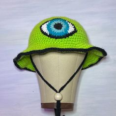 These unique bucket hats are perfect for any occasion! Trendy Adjustable Crochet Hat For Outdoor, Trendy Adjustable Bucket Hat With Curved Brim, Fun Handmade Cap, Trendy Brimmed Hats For Festivals, Trendy Brimmed Festival Hats, Trendy Crochet Cap For Outdoor, Trendy Brimmed Crochet Hat For Outdoors, Trendy Green Crochet Hat, Retro Brimmed Bucket Hat For Winter