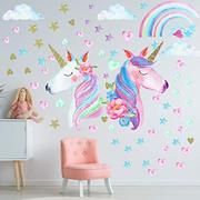 a child's room with two unicorns on the wall and stars in the background