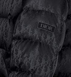 The black technical jacquard down jacket pays tribute to House heritage with a tonal Dior Oblique motif. Both modern and relaxed, it features a two-way zip closure with double pulls, a Dior soft patch on the sleeve and insulating goose down filling. The down jacket will lend a hallmark touch to any outfit.. 52 Cold Pics, Dior Coat, Denim Swimsuit, Dior Jacket, Pretty Sneakers, Designer Jackets For Men, Dior Star, Icon Shoes, Dior Oblique