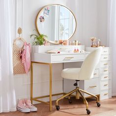 a white desk topped with a mirror and a chair