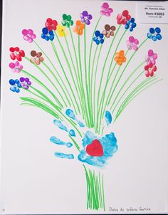 a child's handprint with flowers in it