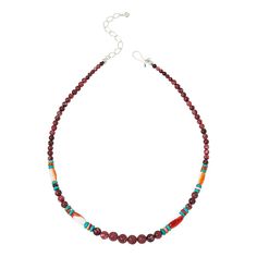 a necklace with beads and stones on it