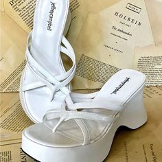 Free People Jeffrey Campbell Year 3000 Platform Wedge Thong Sandal White Wrapped Leather Wedge * Strappy Thong Sandal New Without Box * Size: 9.5 1.5" Front Platform * 3.5" Heel Please Note Line Through Inside Label Prevent Store Return White Synthetic Wedge Heel Platform Slippers, White Toe Post Wedge Sandals For Summer, White Platform Wedge Sandals, Synthetic Wedge Toe Post Sandals, Synthetic Single Toe Strap Wedge Sandals With Platform, White Platform Slippers With Removable Insole, White Platform Slippers With Removable Insole For Summer, White Wedge Heel Sandals, White Toe Post Heels With Heel Loop