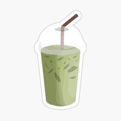 a green drink with a straw sticking out of it