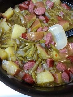 the food is being cooked in the pot on the stove top and ready to be eaten