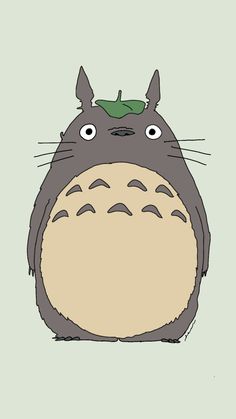 an image of a totoro with green leaves on it's head and eyes