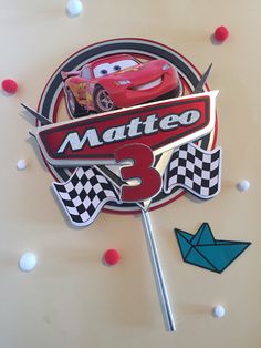 a cake with cars on it and the name matero 3