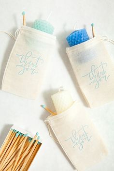 three small bags with matches and some cotton swabs