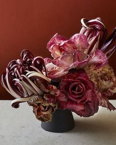 a vase filled with flowers on top of a table