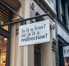 a sign on the side of a building that says is it a loss or is it a redirection?