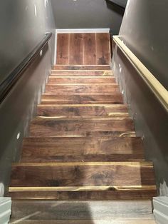 the stairs are made from wood and have clear acrylic tape on them to keep them clean