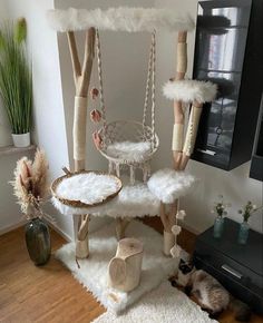 a living room filled with lots of furniture and decor on top of a wooden floor