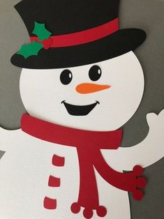 a close up of a snowman with a hat and scarf