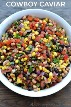 a white bowl filled with black eyed peas, corn and cilantro garnish