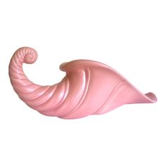 a pink object that is shaped like an elephant's tail, on a white background